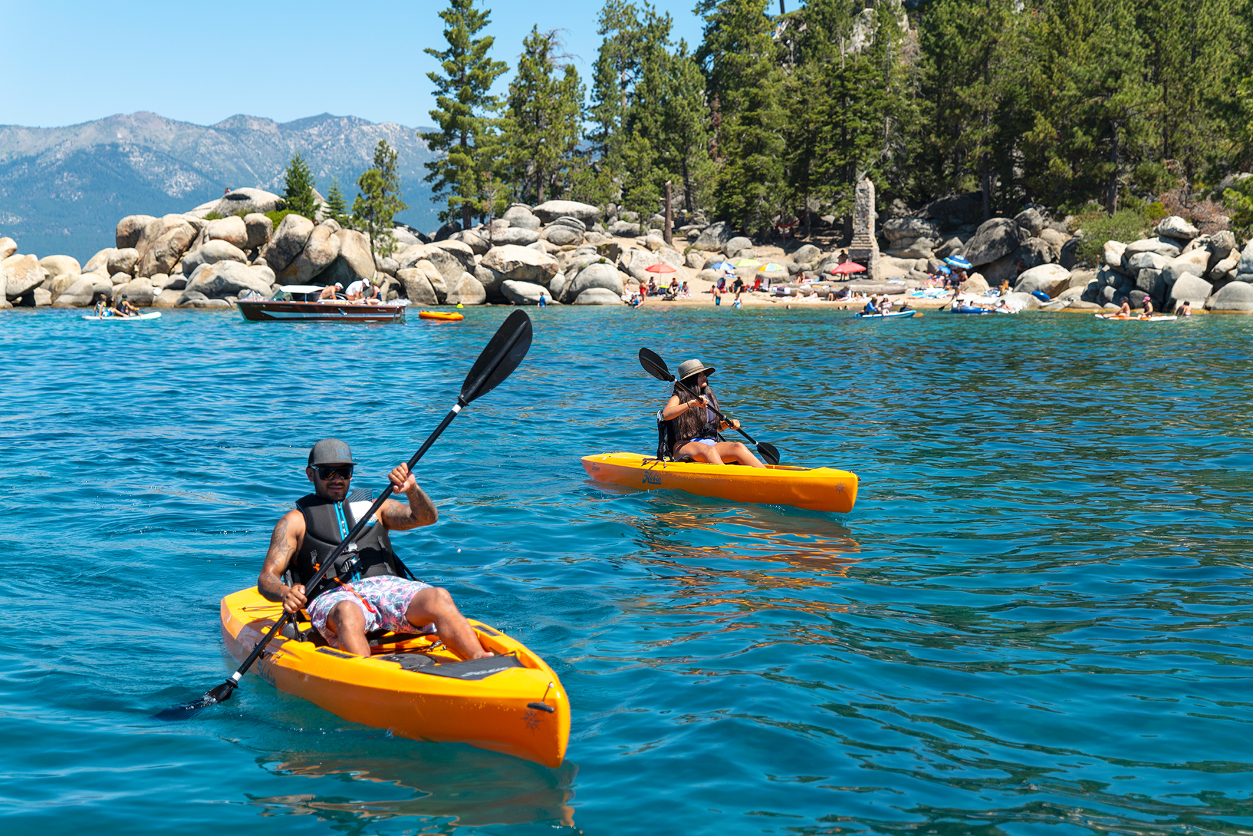 Two people paddling a kayak on Lake Tahoe